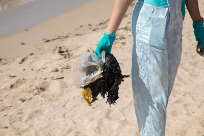 Man holding fish at beach