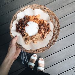 Low section of person having food