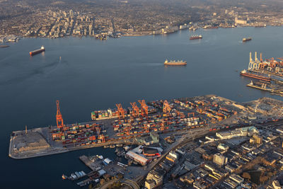 High angle view of commercial dock and buildings in city