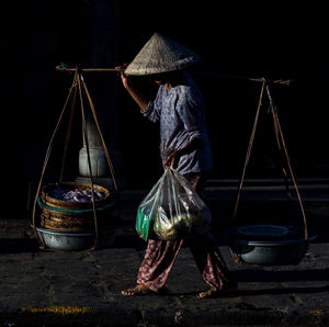 Woman standing at night