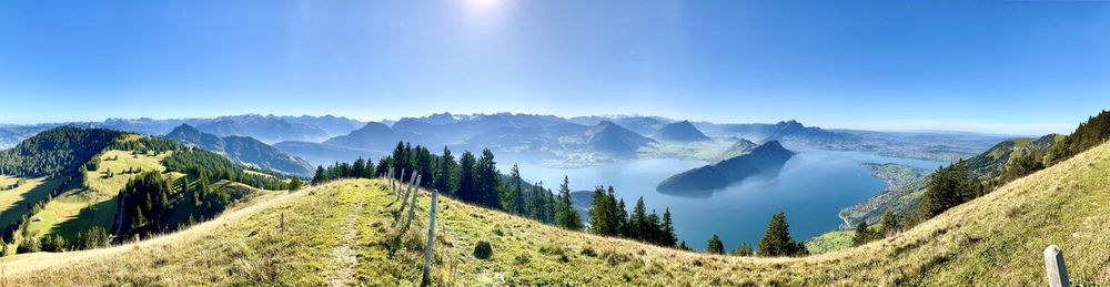 Panoramic view of mountains against clear blue sky