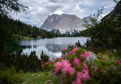 Scenic view of lake and mountains against sky