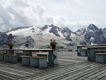 Scenic mountain view, table and bench to the queen of the dolomites, marmolada in alto adige, italy 