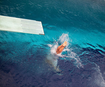 Low section of person in swimming pool