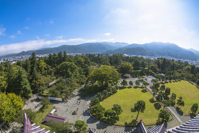 High angle view of trees and buildings against sky