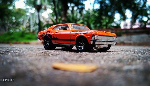 Close-up of toy car on road