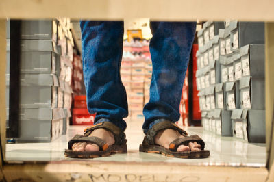 Low section of man standing on floor