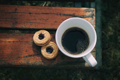 Close-up of tea with biscuits on table