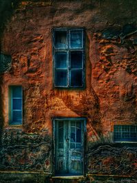 Low angle view of window on old building