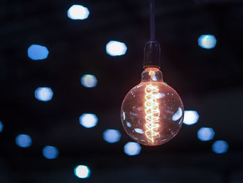 Close-up of illuminated light bulb