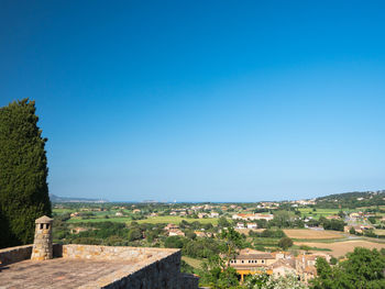 Scenic view of historic building against clear blue sky