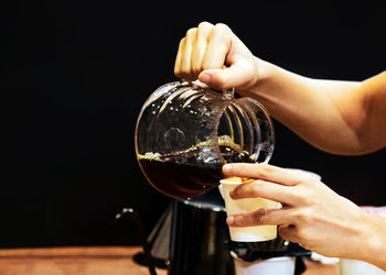 Close-up of man holding wineglass