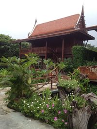 Exterior of house in front of plants against clear sky