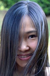 Close-up portrait of a smiling young woman