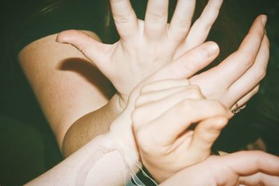 Close-up of mother and baby hands 