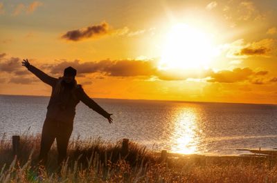 Scenic view of sea at sunset