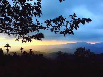 Silhouette of landscape against cloudy sky