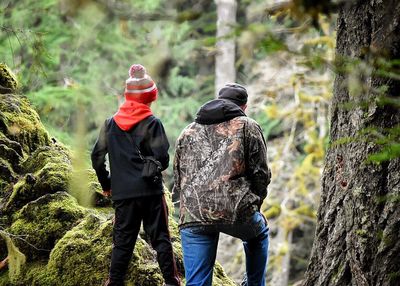 Rear view of people walking outdoors