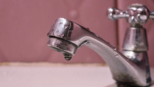 Close-up of faucet in bathroom