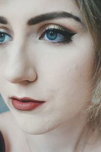 Close-up portrait of beautiful woman looking away