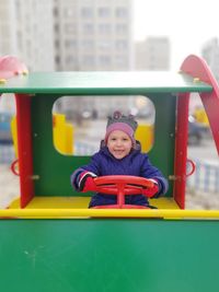 Portrait of smiling girl playing in playground