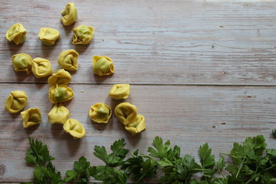 High angle view of fruits and leaves on table