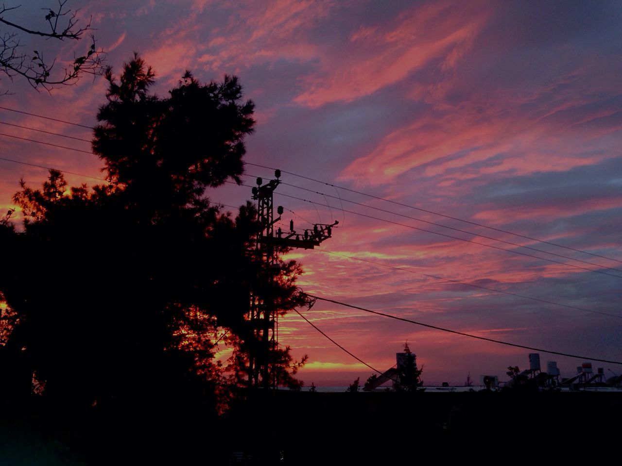 silhouette, sunset, power line, sky, electricity pylon, low angle view, tree, electricity, power supply, beauty in nature, cable, tranquility, scenics, connection, cloud - sky, orange color, nature, tranquil scene, cloud, power cable