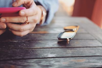 Close-up of woman hand on table