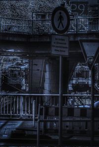 Information sign on bridge at night