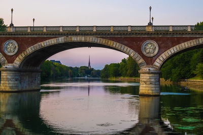 Arch bridge over river