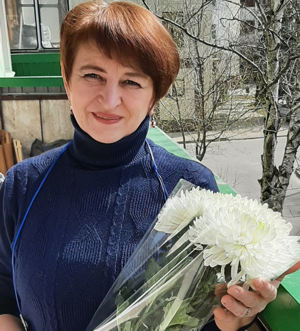 one person, portrait, plant, looking at camera, smiling, flower, nature, adult, emotion, holding, happiness, person, flowering plant, clothing, waist up, front view, women, spring, men, lifestyles, standing, casual clothing, female, young adult, child, day, outdoors, leisure activity, floristry, beauty in nature