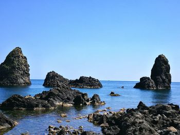 Scenic view of sea against blue sky