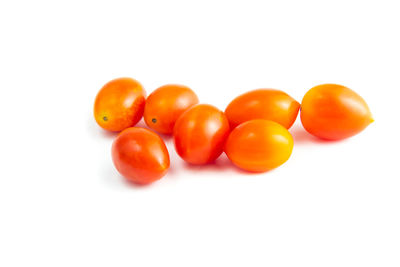 Close-up of tomatoes against white background