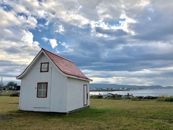 House on field against sky