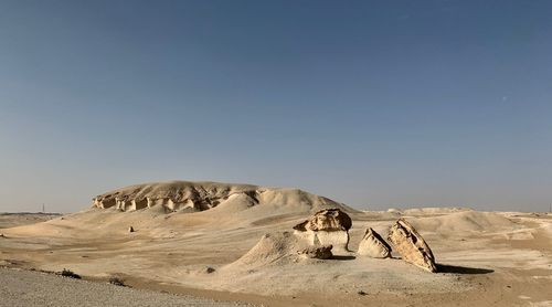 Scenic view of desert against clear sky