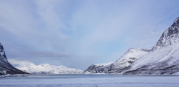 Scenic view of snowcapped mountains against sky