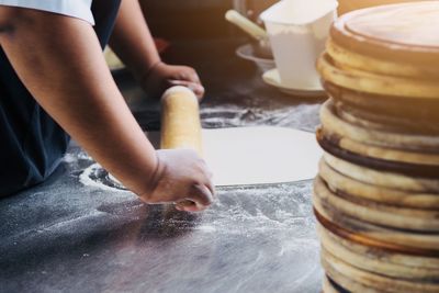 Midsection of man preparing food