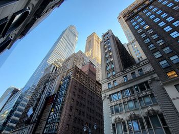 Low angle view of skyscrapers against sky