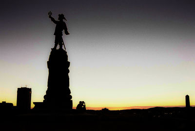 Low angle view of statue against sky