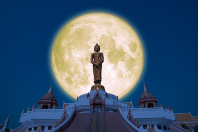 Digital composite image of historic building against blue sky