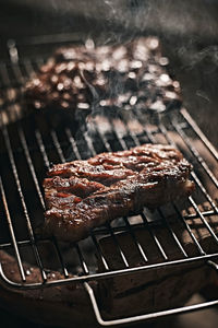 Close-up of meat on barbecue grill