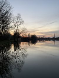 Scenic view of lake against sky during sunset