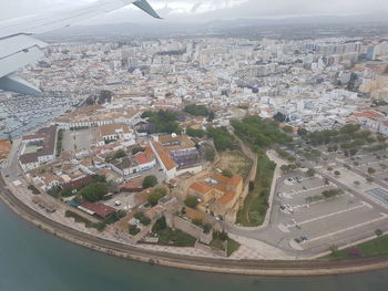 Aerial view of cityscape against sky