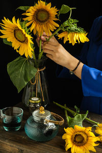 Midsection of woman holding bouquet