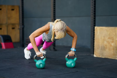 Woman exercising in gym