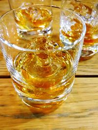 High angle view of whiskey on the rocks glasses on table