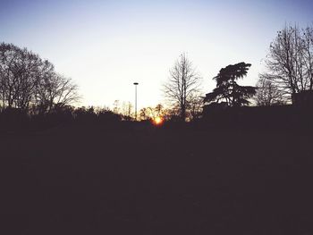 Silhouette of trees against sky during sunset