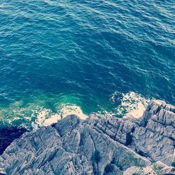 High angle view of rock formation in sea