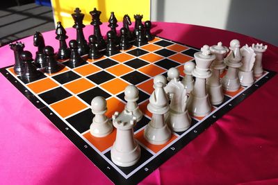 High angle view of chess pieces on table