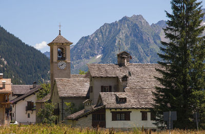 Houses and buildings against sky